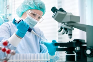 scientist-pipetting-microscope-diagnostics-clinical-PPE.jpg